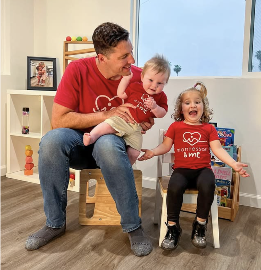 Andrew with his two kids in a Montessori classroom